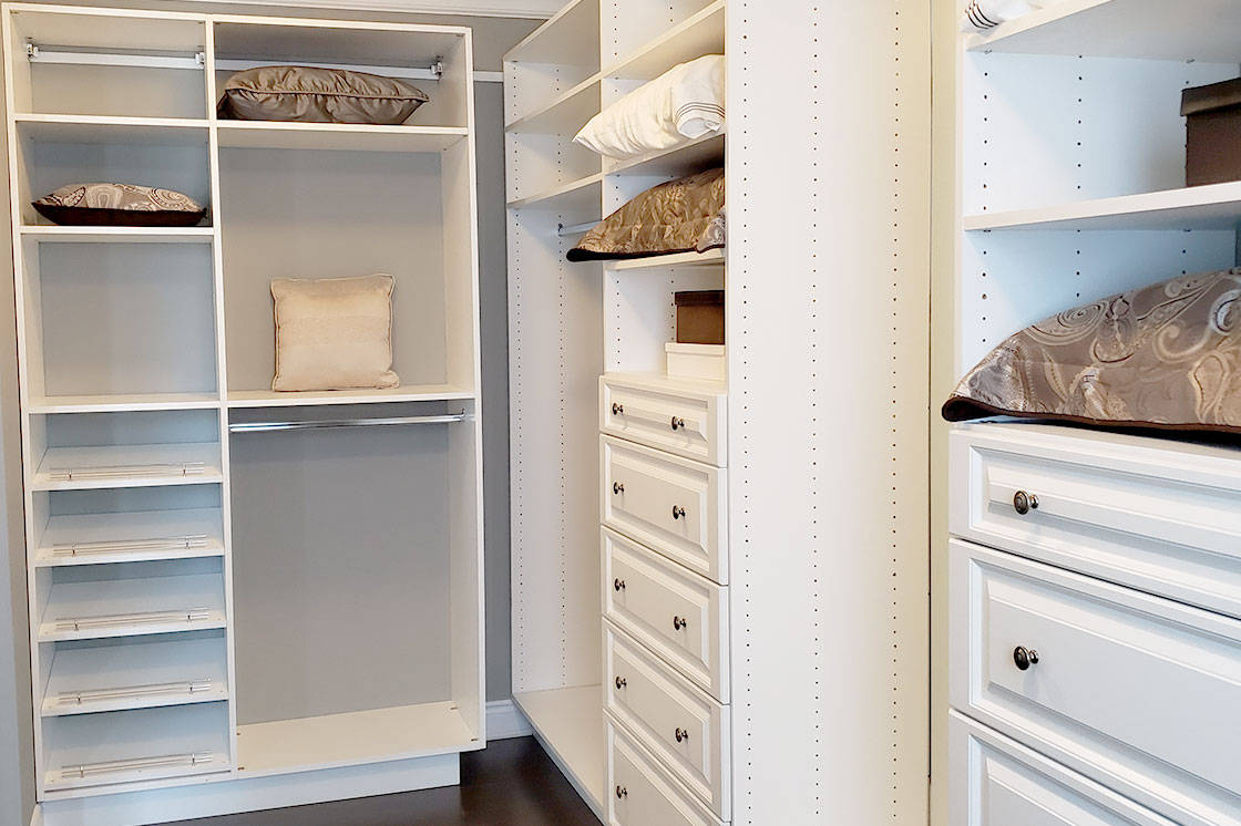 A beautifully organized closet with neatly arranged clothes and accessories.
