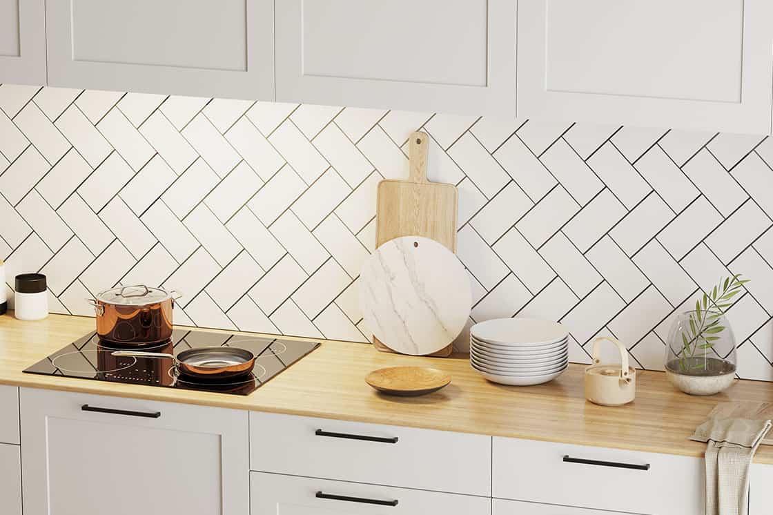 A tidy and streamlined kitchen countertop with labeled containers and utensil holders.