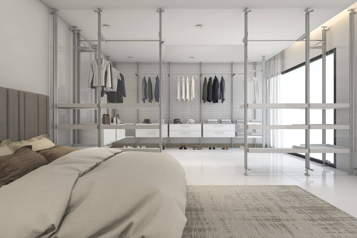 white modern bedroom with a stylish walk-in closet, blending clean lines and contemporary elegance.