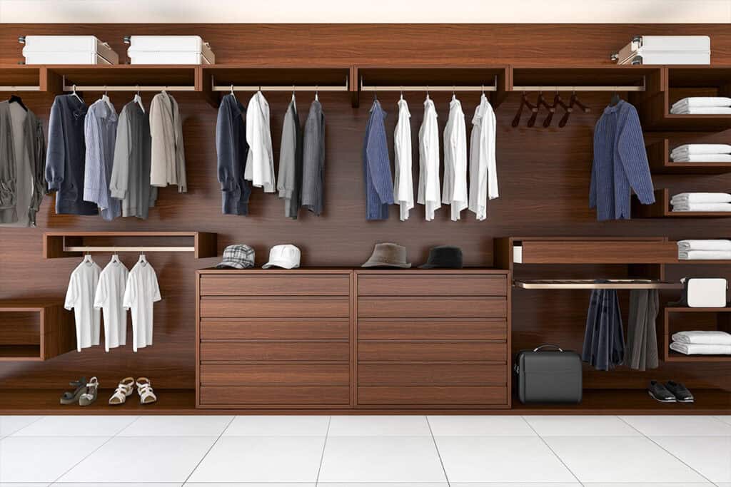 Elegant Walk-in Closet layout in Balm, FL with rich wood tones and organized hanging spaces.