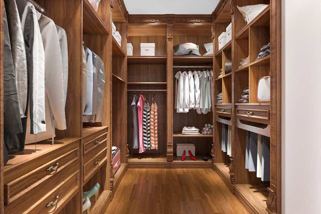 Classic Walk-in Closet style in Balm, FL showcasing detailed wooden cabinets and organized storage.