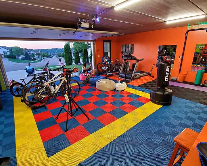 Modern Garage with Epoxy Flooring in Sarasota, Florida Epoxy garage flooring in a Sarasota home with natural lighting and coastal decor
